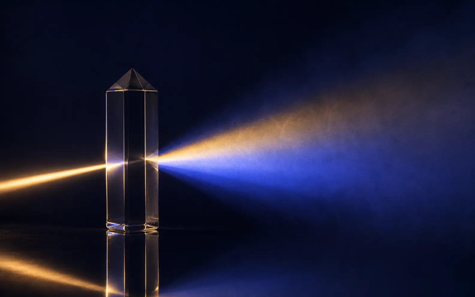 Glass prism turning one warm beam into a fan of blue light, audit and assurance services that bring clarity